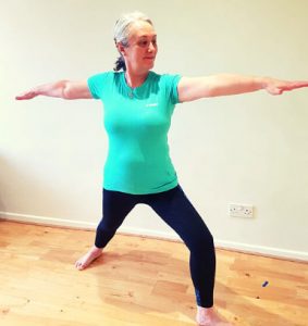 Cardiff Yoga teacher Amanda Powell (Anjali) demonstrates the yoga posture Warrior II or Veeriyasana 2